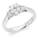 Oval and Pear Shape Three Stone Diamond Ring in Platinum