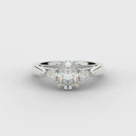Oval and Pear Shape Three Stone Diamond Ring in Platinum
